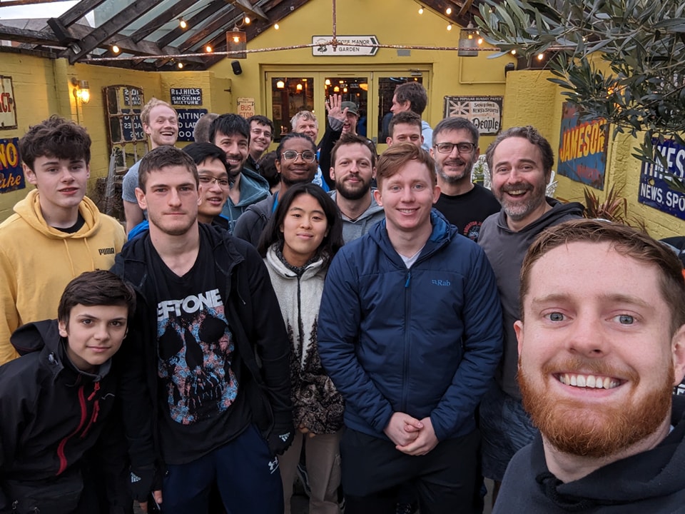 All students and instructors celebrating the grading in the pub