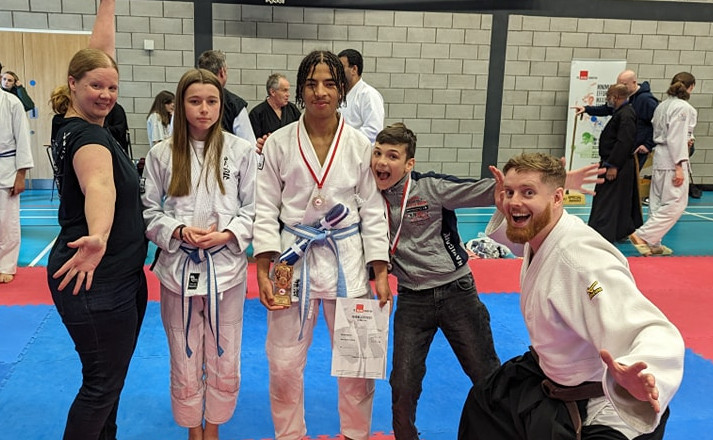 Students and instructors at the junior nationals happy to have received their medals, cup and belt.